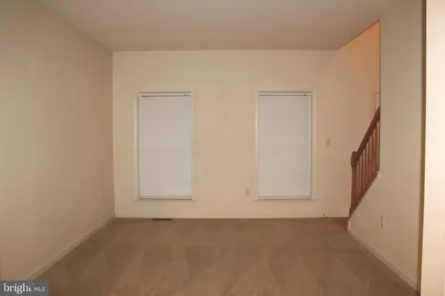 an empty room with a bench