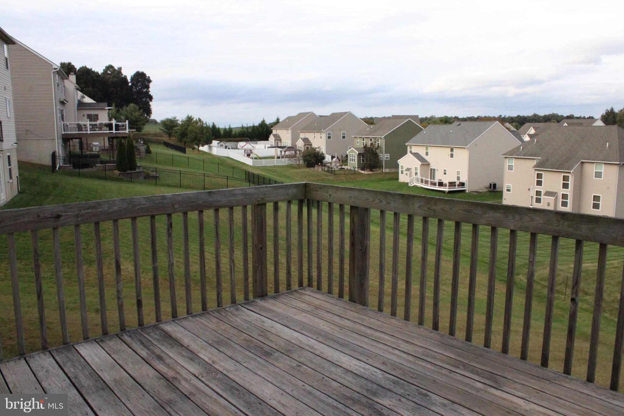 41 Logan Drive New Freedom, PA 17349 - Photo 13 of 27 a balcony with wooden floor and city view