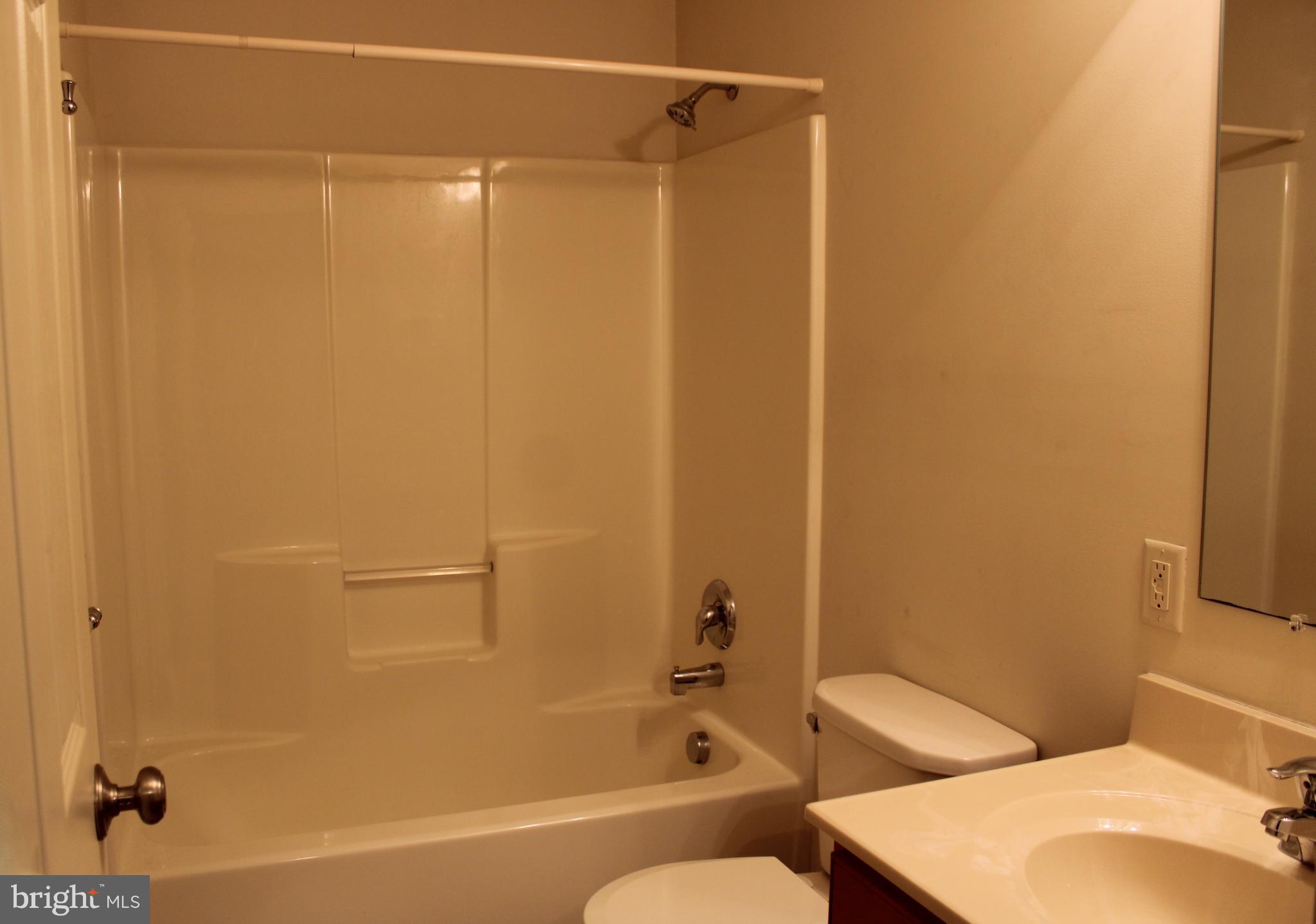 41 Logan Drive New Freedom, PA 17349 - Photo 19 of 27 a bathroom with a shower and a toilet