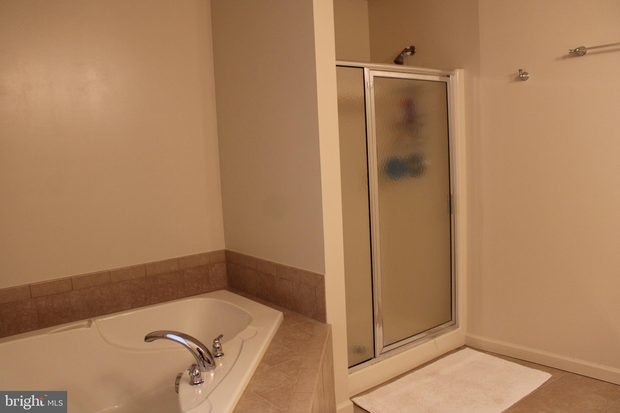 41 Logan Drive New Freedom, PA 17349 - Photo 24 of 27 a bathroom with a tub