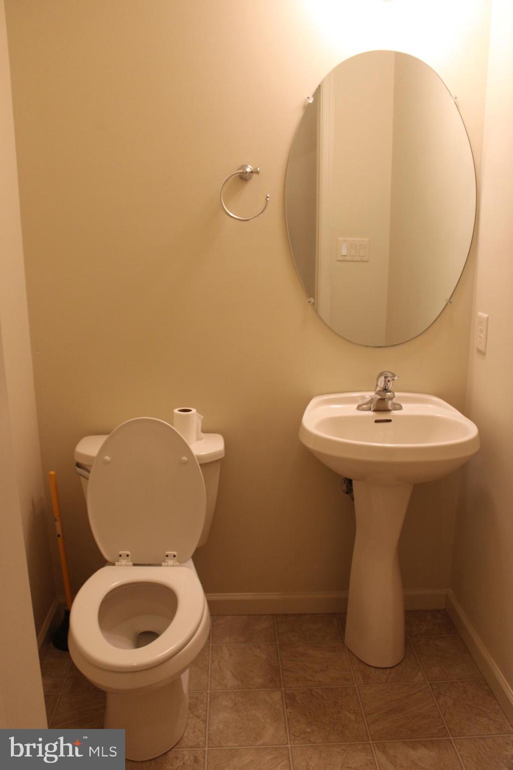 41 Logan Drive New Freedom, PA 17349 - Photo 10 of 27 a bathroom with a toilet sink and mirror