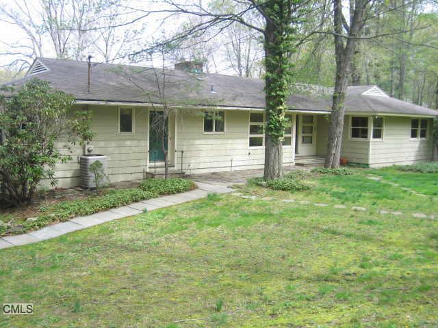 64 Foxwood Road Stamford, CT 06903 - Photo 1 of 1 a front view of a house with a yard