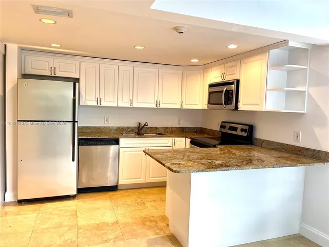 a bathroom with a shower and a glass door