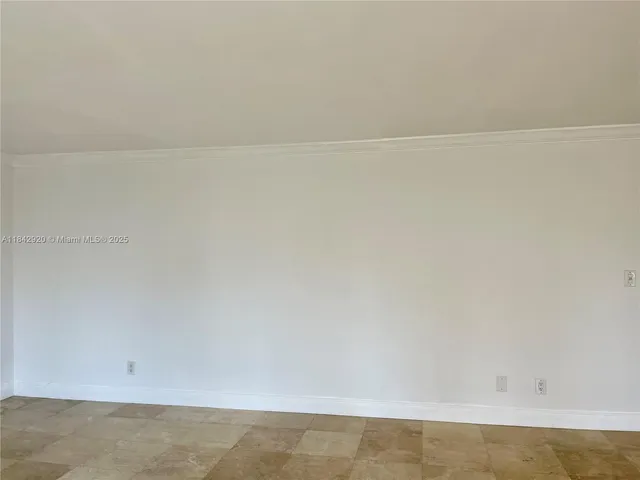 a view of a room with a table and a chair