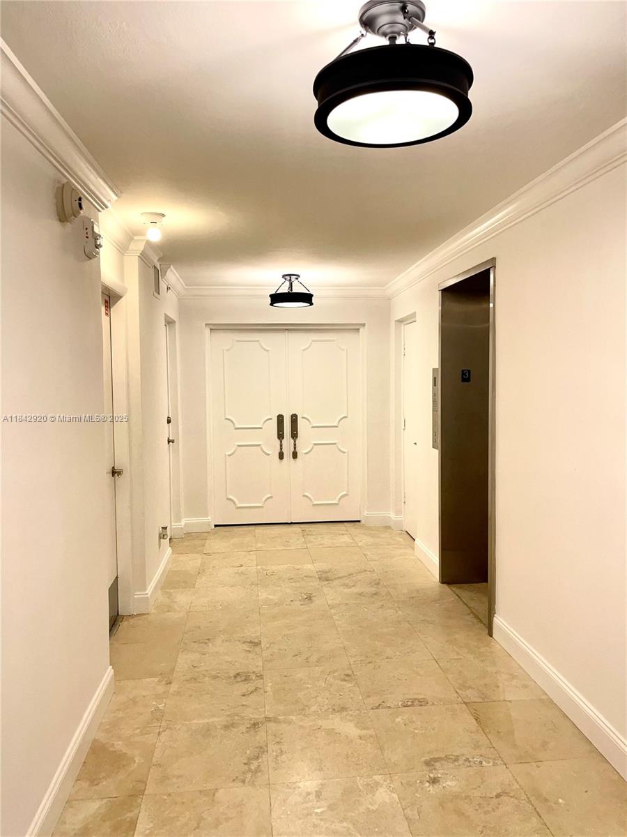 607 Ocean Drive, Unit 3K Key Biscayne, FL 33149 - Photo 17 of 18 a view of a room with a table and a chair