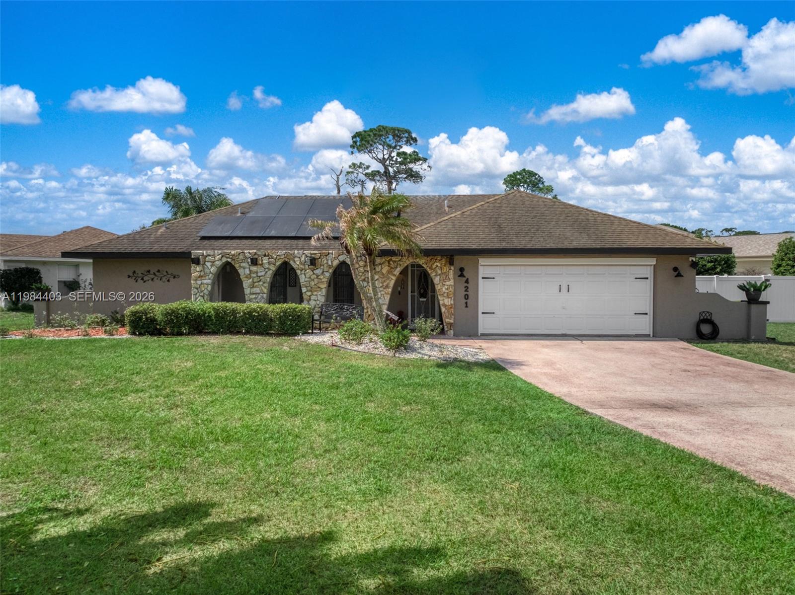 4201 Westminster Road Sebring, FL 33875 - Photo 1 of 43 a front view of a house with garden