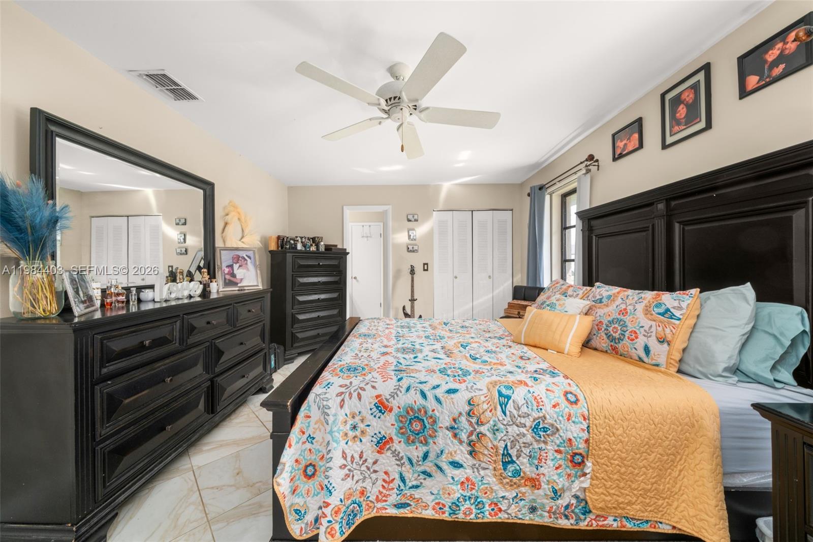 4201 Westminster Road Sebring, FL 33875 - Photo 17 of 43 a bed room with a bed window and dresser