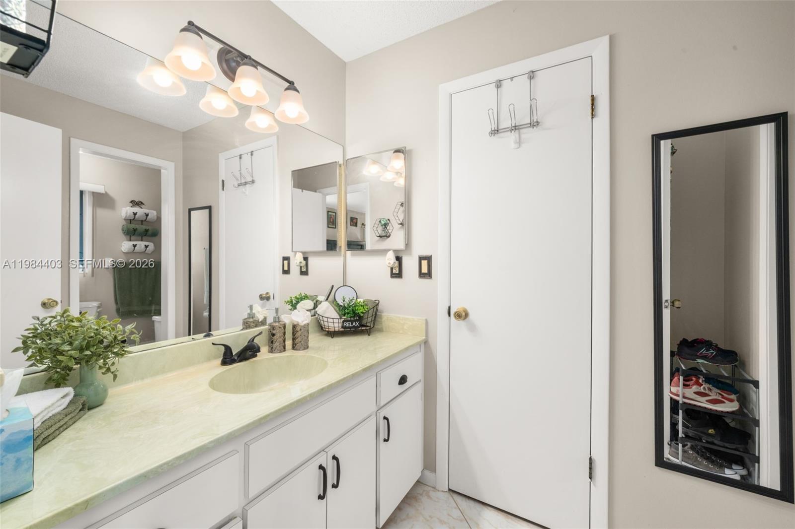 4201 Westminster Road Sebring, FL 33875 - Photo 20 of 43 a bathroom with a sink and a mirror