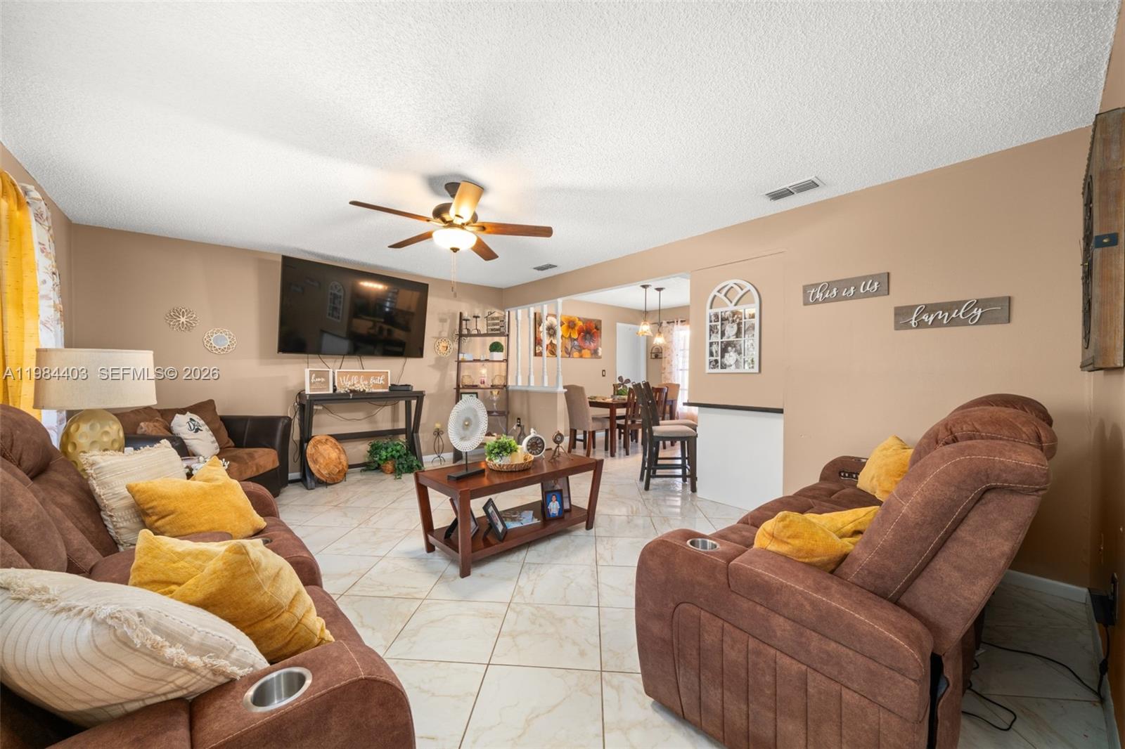 4201 Westminster Road Sebring, FL 33875 - Photo 2 of 43 a living room with furniture kitchen view and a flat screen tv