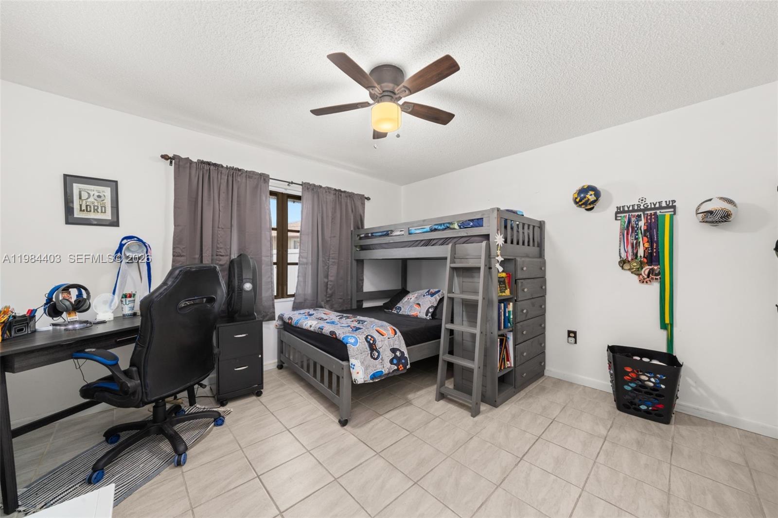 4201 Westminster Road Sebring, FL 33875 - Photo 22 of 43 a bedroom with bed and a desk
