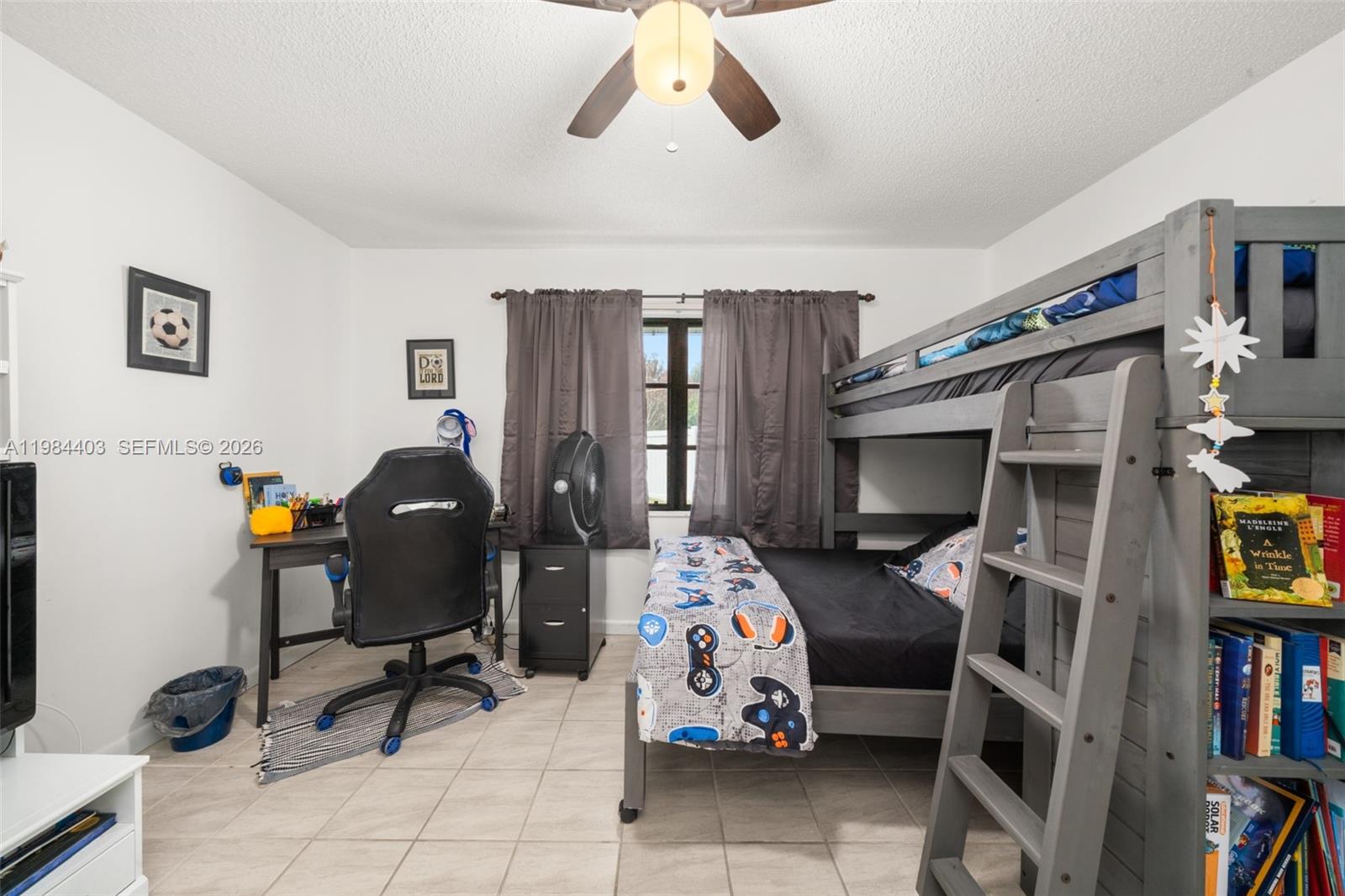 4201 Westminster Road Sebring, FL 33875 - Photo 23 of 43 a bedroom with furniture a flat screen tv and a window