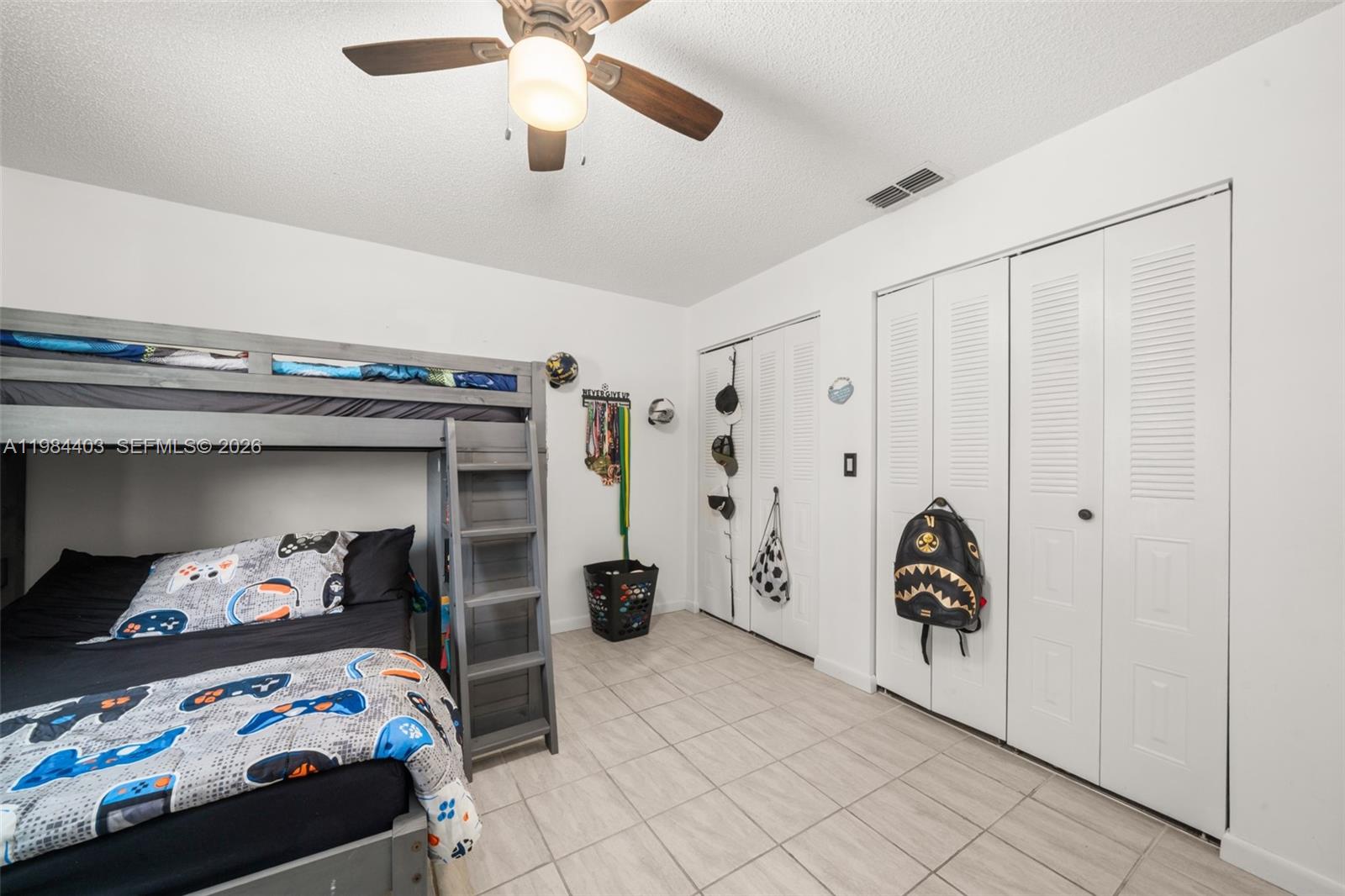 4201 Westminster Road Sebring, FL 33875 - Photo 24 of 43 a bedroom with a bed and a window