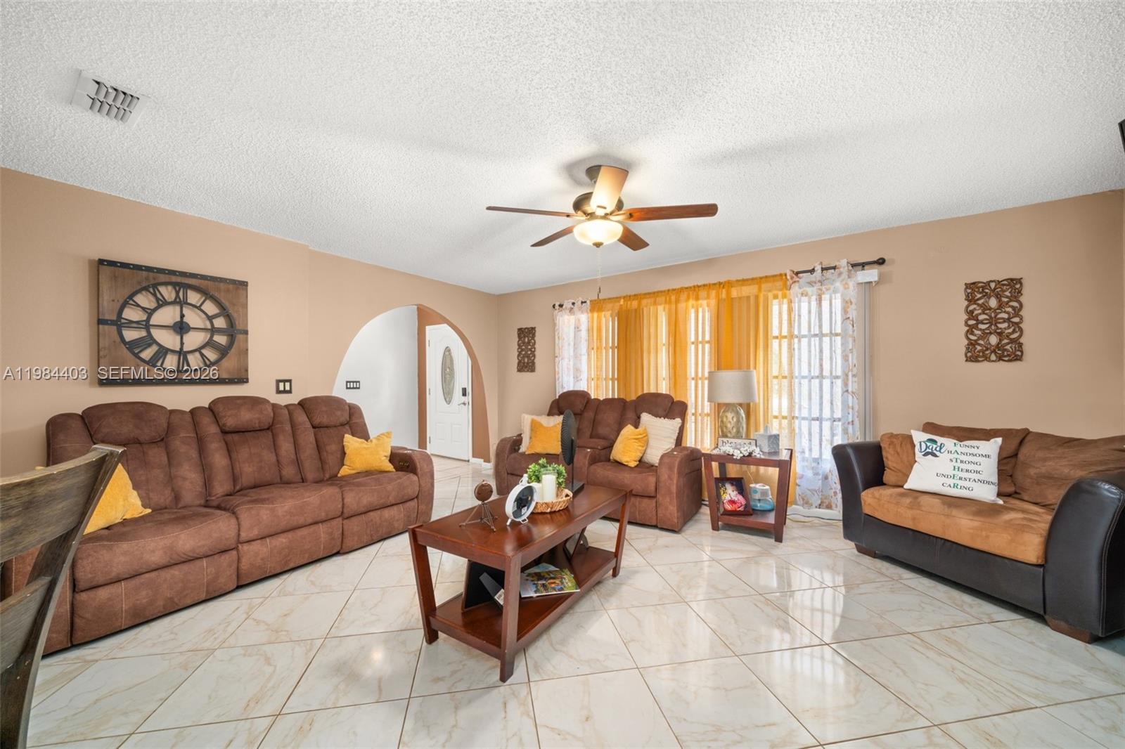 4201 Westminster Road Sebring, FL 33875 - Photo 3 of 43 a living room with furniture and a large window