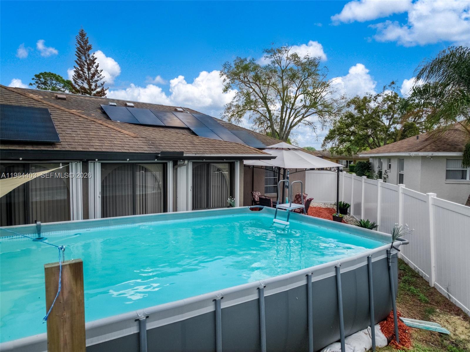 4201 Westminster Road Sebring, FL 33875 - Photo 32 of 43 a view of a house with backyard and sitting area