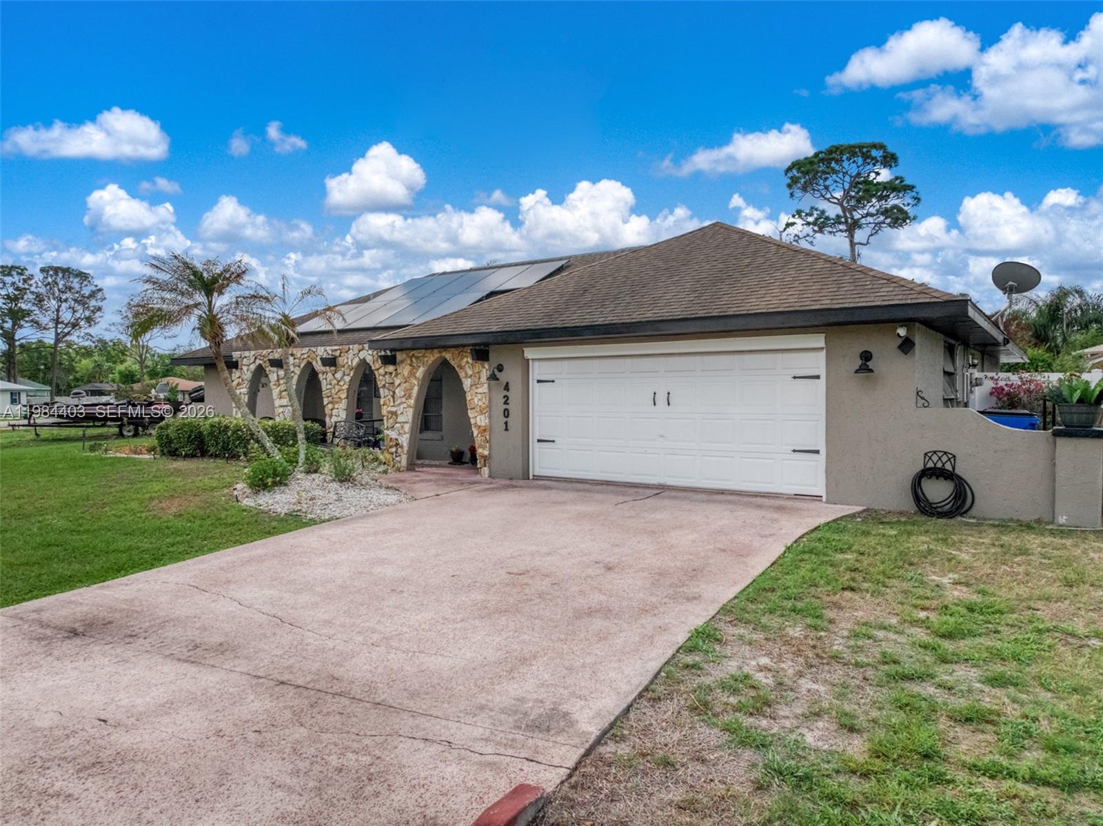 4201 Westminster Road Sebring, FL 33875 - Photo 35 of 43 a front view of a house with garden