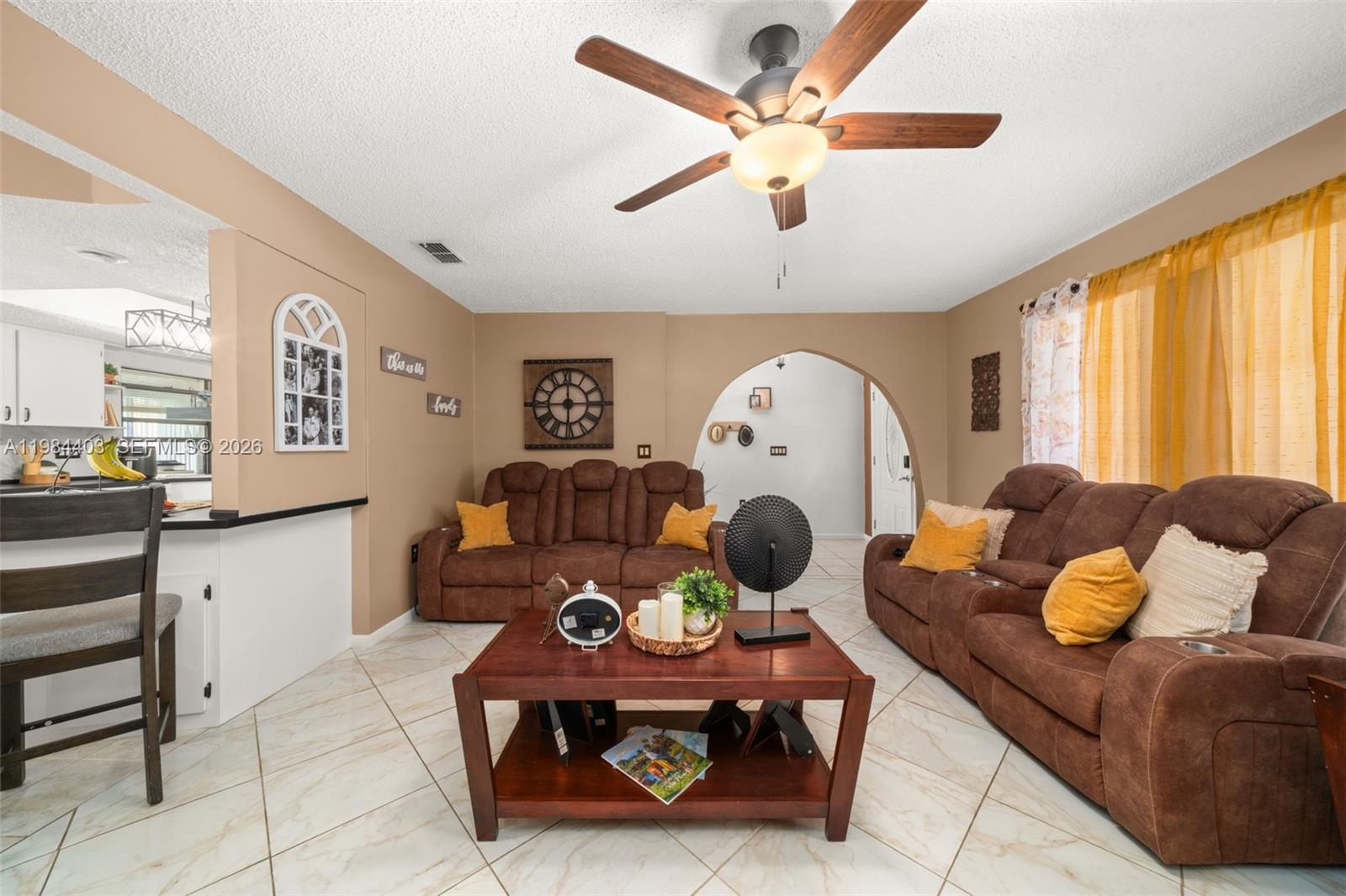 4201 Westminster Road Sebring, FL 33875 - Photo 5 of 43 a living room with furniture and a large window