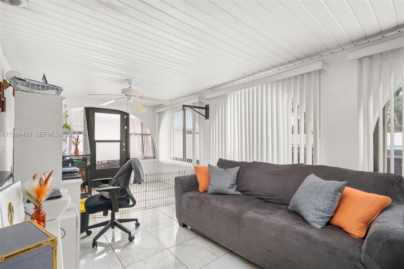 4201 Westminster Road Sebring, FL 33875 - Photo 7 of 43 a living room with furniture and large windows