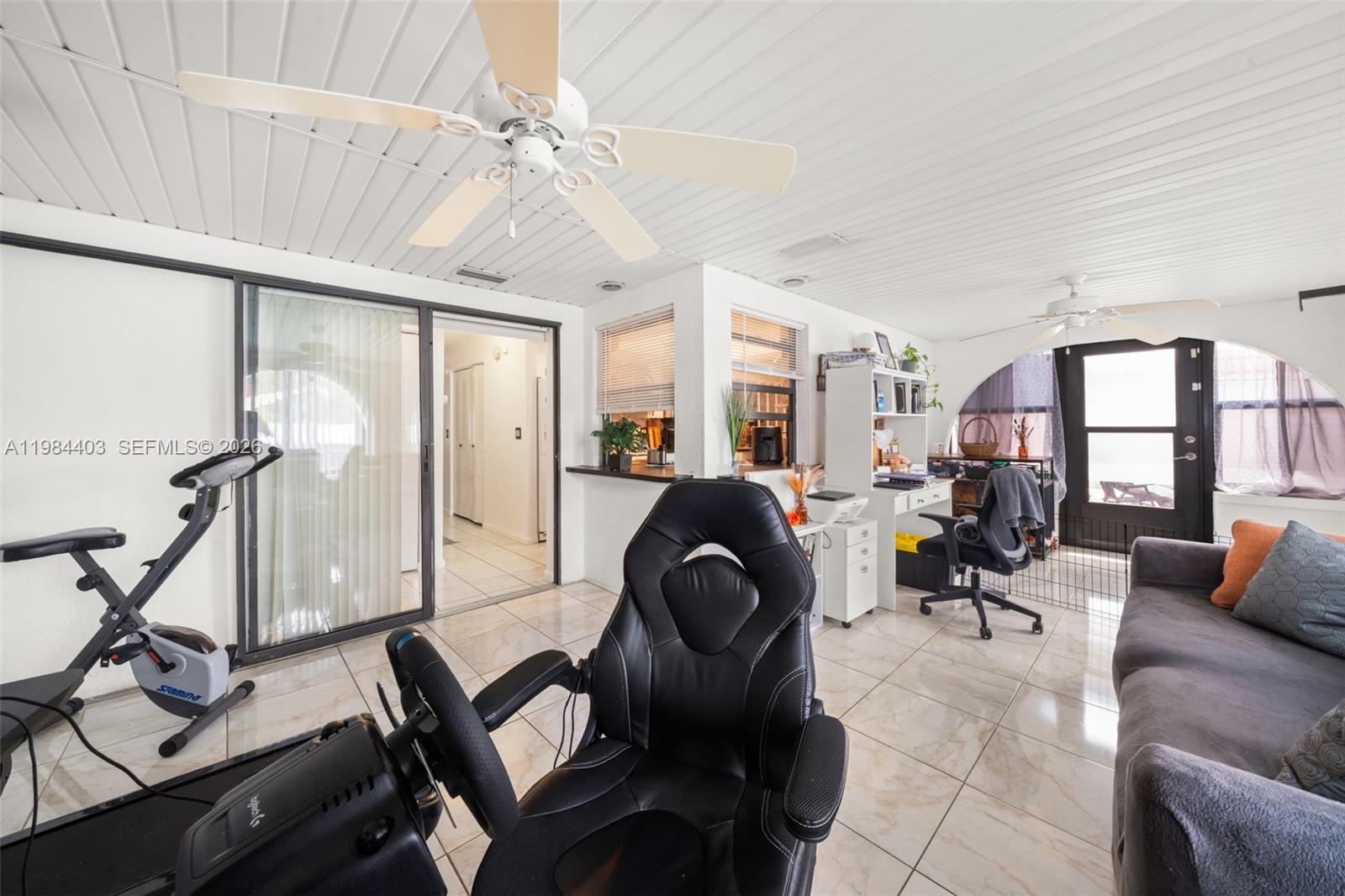 4201 Westminster Road Sebring, FL 33875 - Photo 8 of 43 a living room filled with furniture and a chandelier