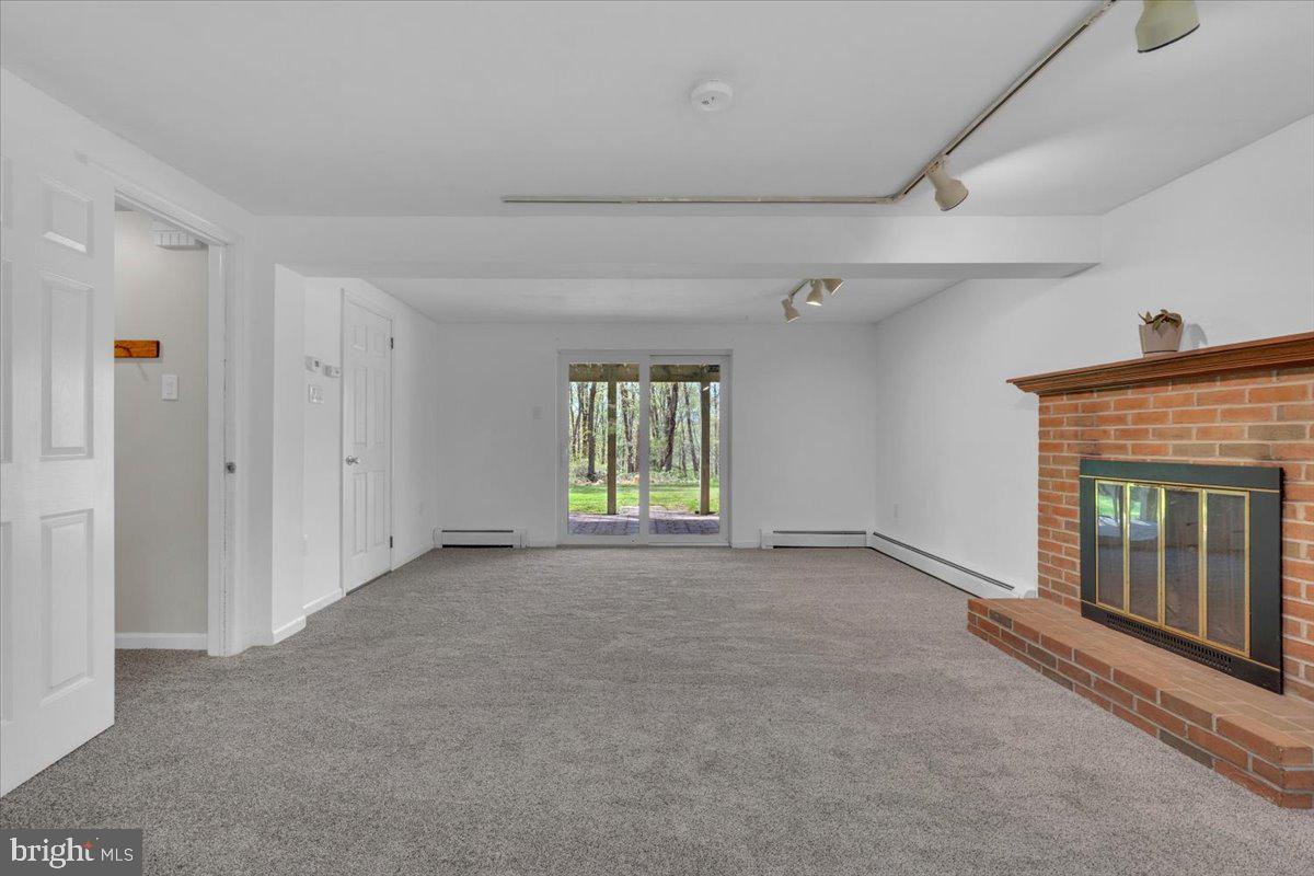 1424 Oakwood Road Coatesville, PA 19320 - Photo 21 of 41 Lower level family room with fireplace