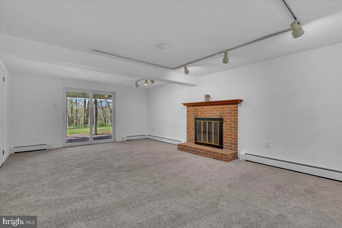 1424 Oakwood Road Coatesville, PA 19320 - Photo 22 of 41 Lower level family room with fireplace
