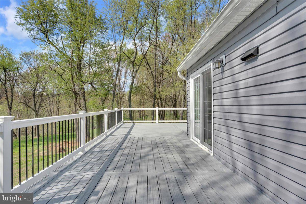 1424 Oakwood Road Coatesville, PA 19320 - Photo 32 of 41 Oversized Trex deck & slider entry to kitchen