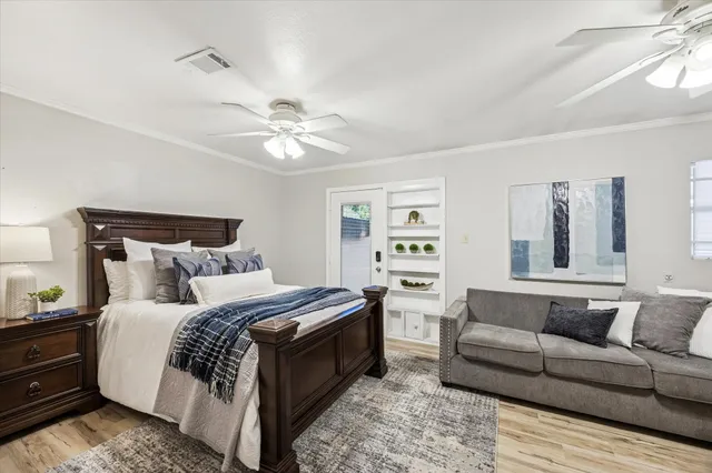 a bedroom with a large bed and a couch