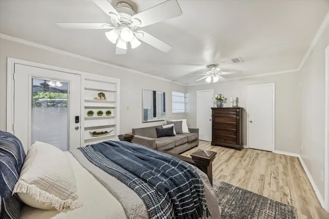a bedroom with a large bed and a window