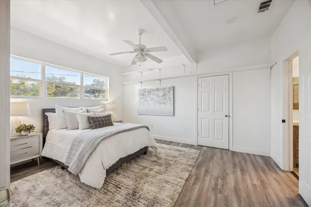 a bathroom with a double vanity sink mirror and shower