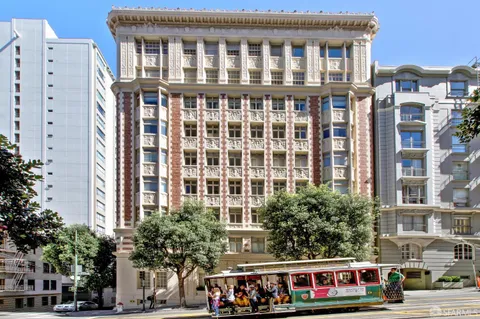 a front view of a building with a lot of windows