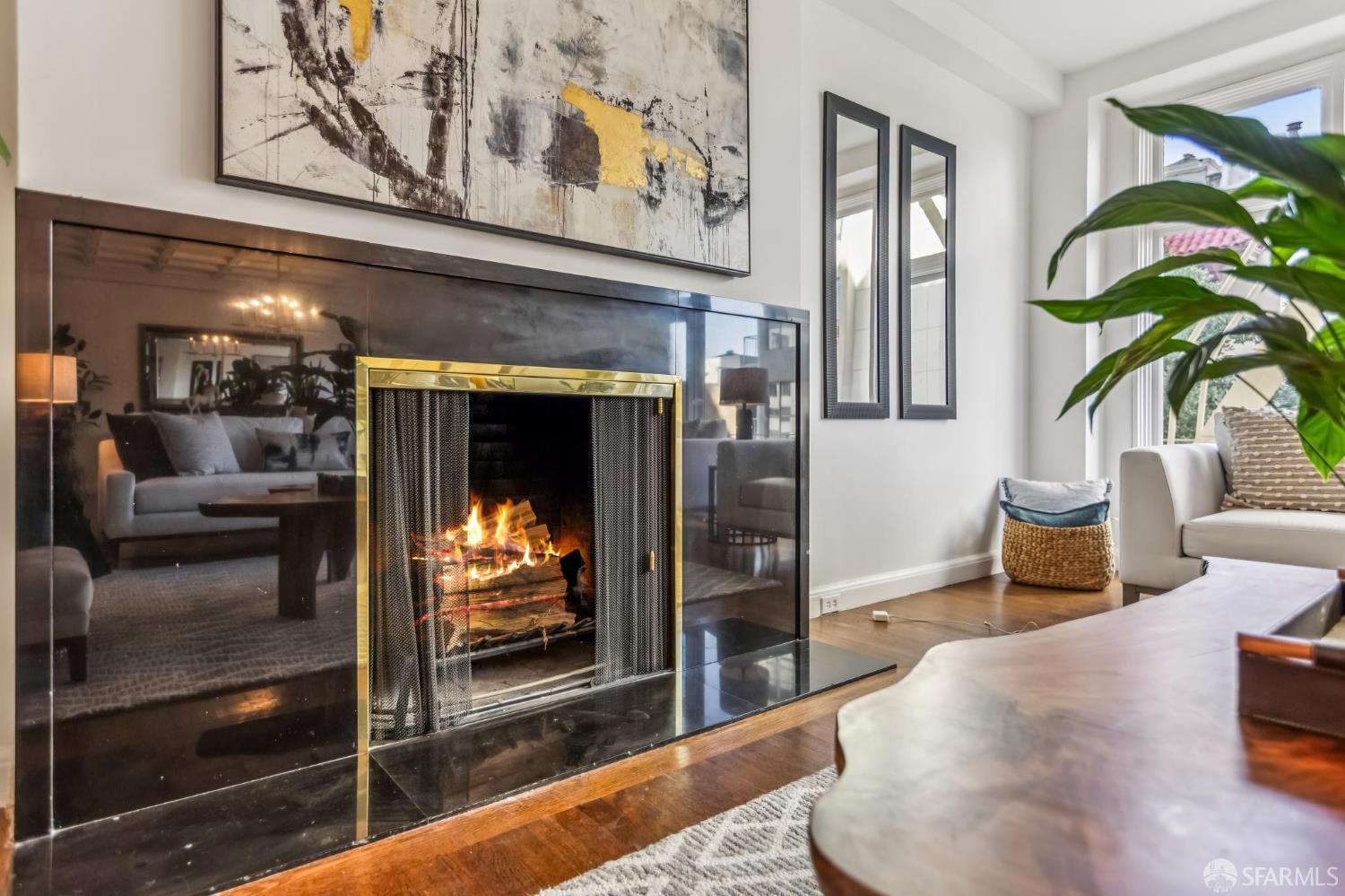 850 Powell Street, Unit 202 San Francisco, CA 94108 - Photo 12 of 51 a living room with furniture and a fireplace