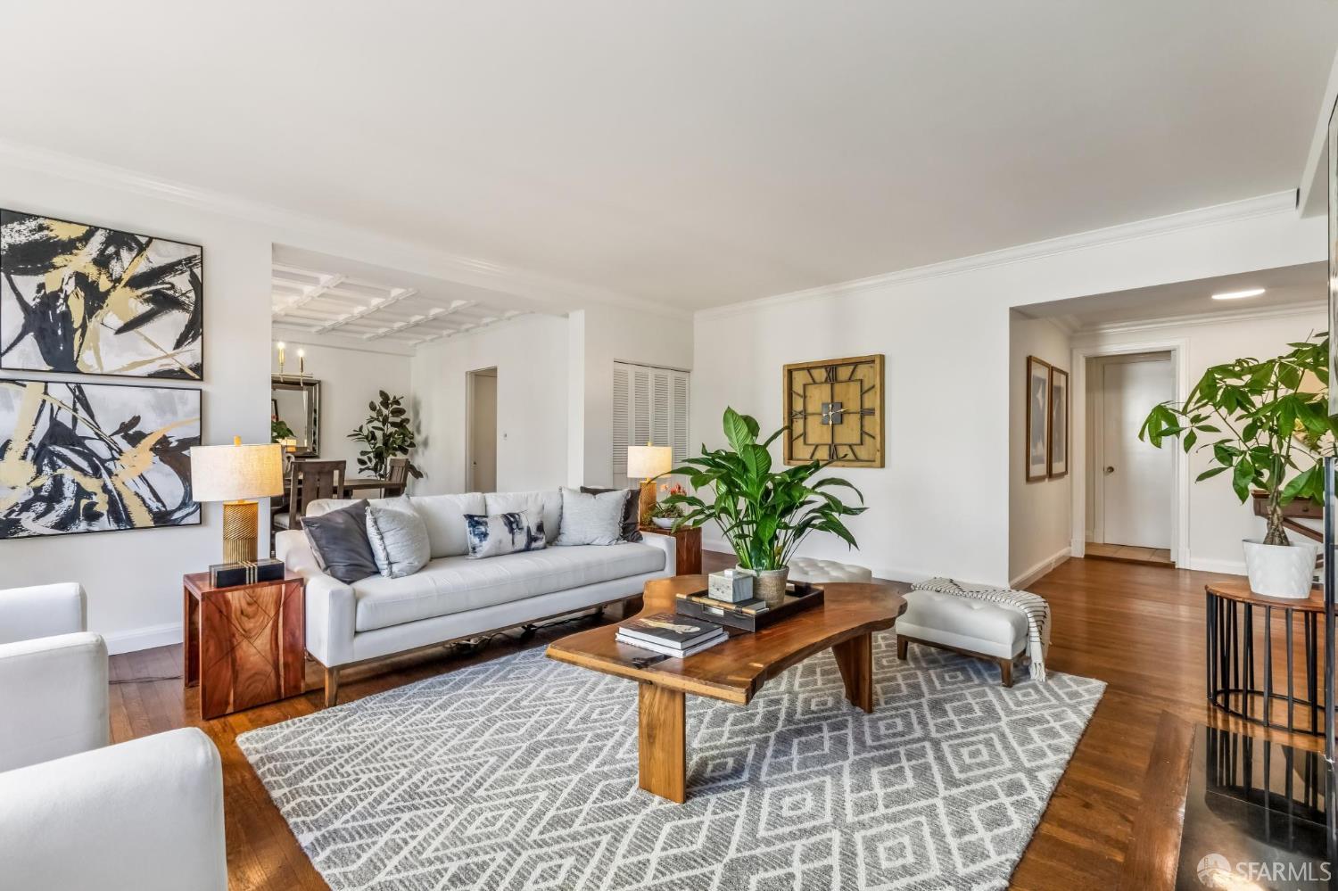 850 Powell Street, Unit 202 San Francisco, CA 94108 - Photo 14 of 51 a living room with furniture potted plant and a rug