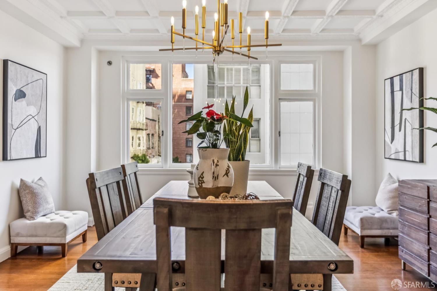 850 Powell Street, Unit 202 San Francisco, CA 94108 - Photo 20 of 51 a view of a dining room with furniture wooden floor and chandelier
