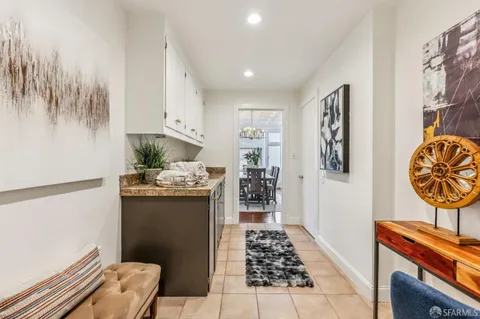 a kitchen with stainless steel appliances a refrigerator and a stove