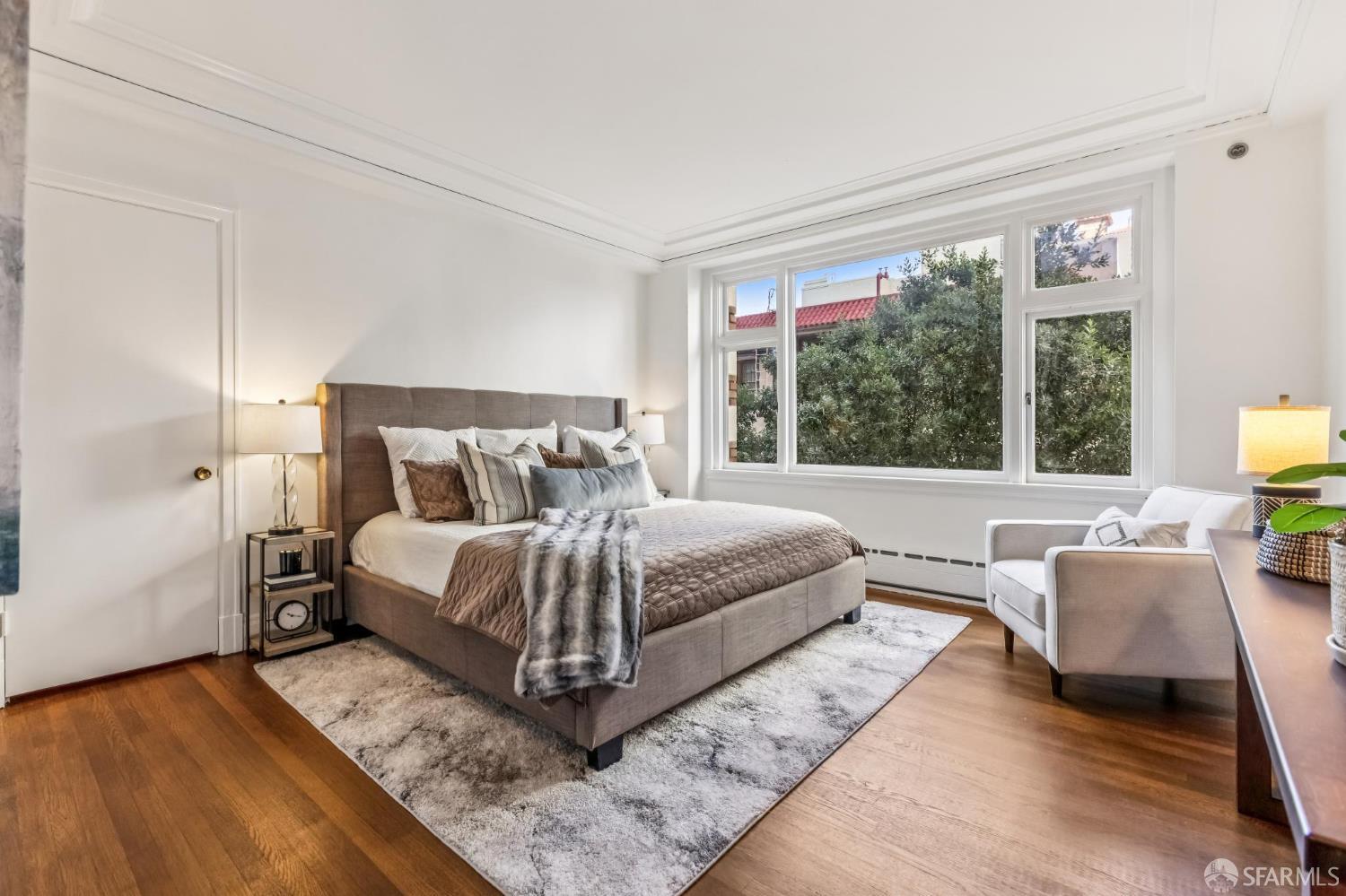 850 Powell Street, Unit 202 San Francisco, CA 94108 - Photo 33 of 51 a bedroom with a large bed and a large window