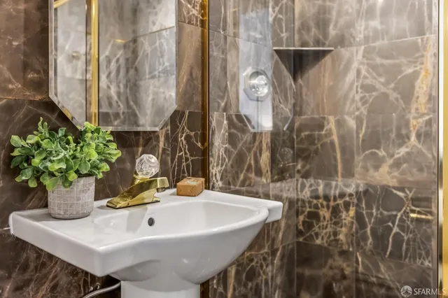 a bathroom with a sink and a mirror