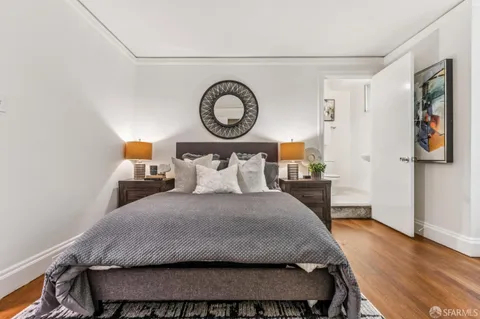 a bedroom with a bed and a table in it