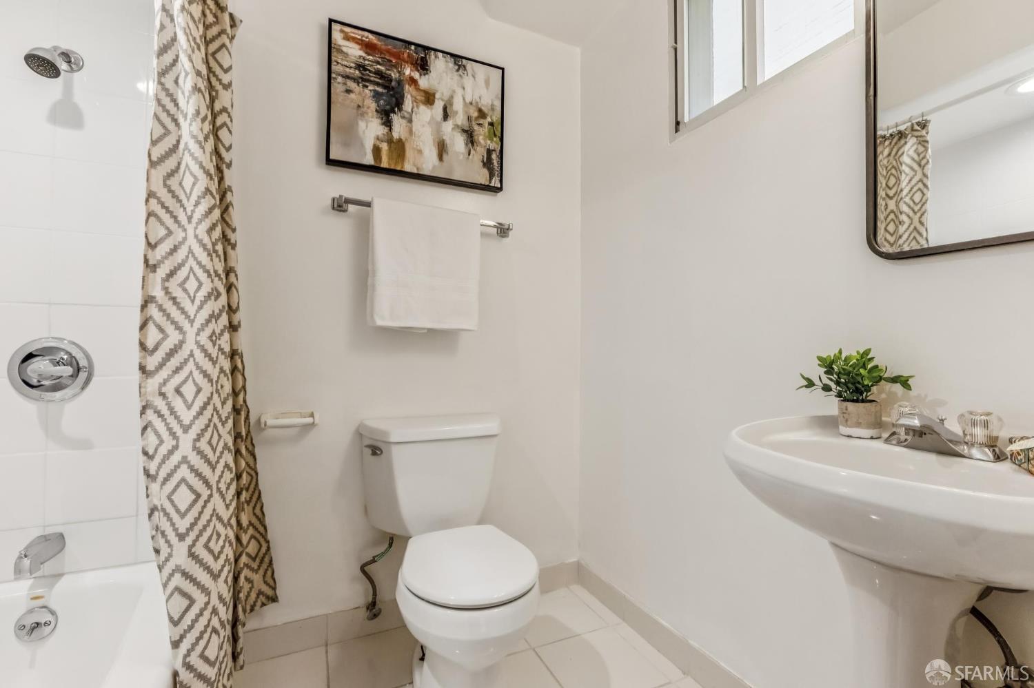 850 Powell Street, Unit 202 San Francisco, CA 94108 - Photo 41 of 51 a bathroom with a toilet and sink