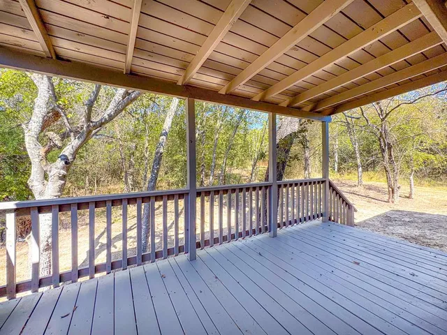 a view of porch with wooden floor