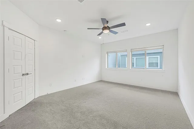 a spacious bathroom with a tub sink and mirror