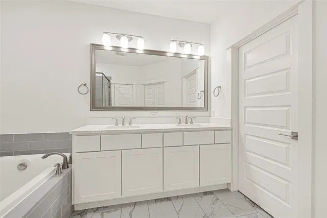 a view of a house with a big yard and large trees