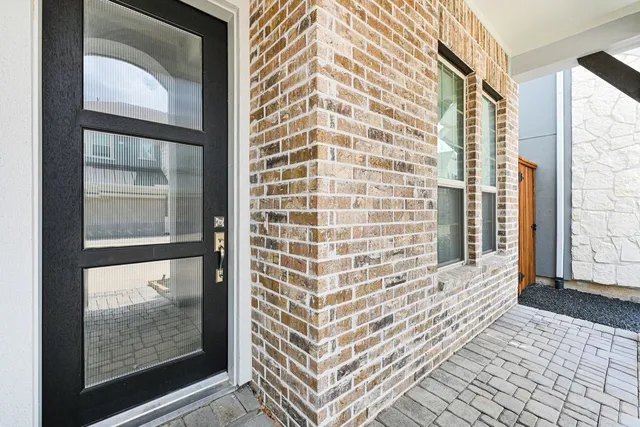 an aerial view of multiple houses with yard