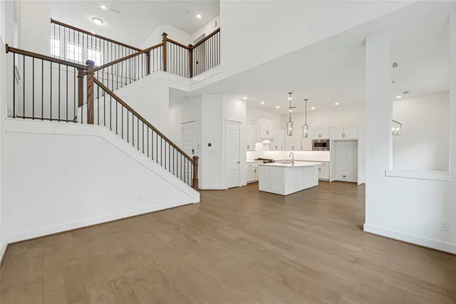 a view of a kitchen with furniture and an empty room
