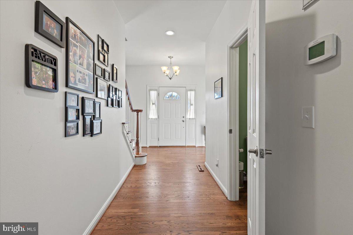 9448 Old Solomons Island Road Owings, MD 20736 - Photo 11 of 49 Front door with elegant side glass panels