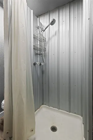 a bathroom with a tub and shower