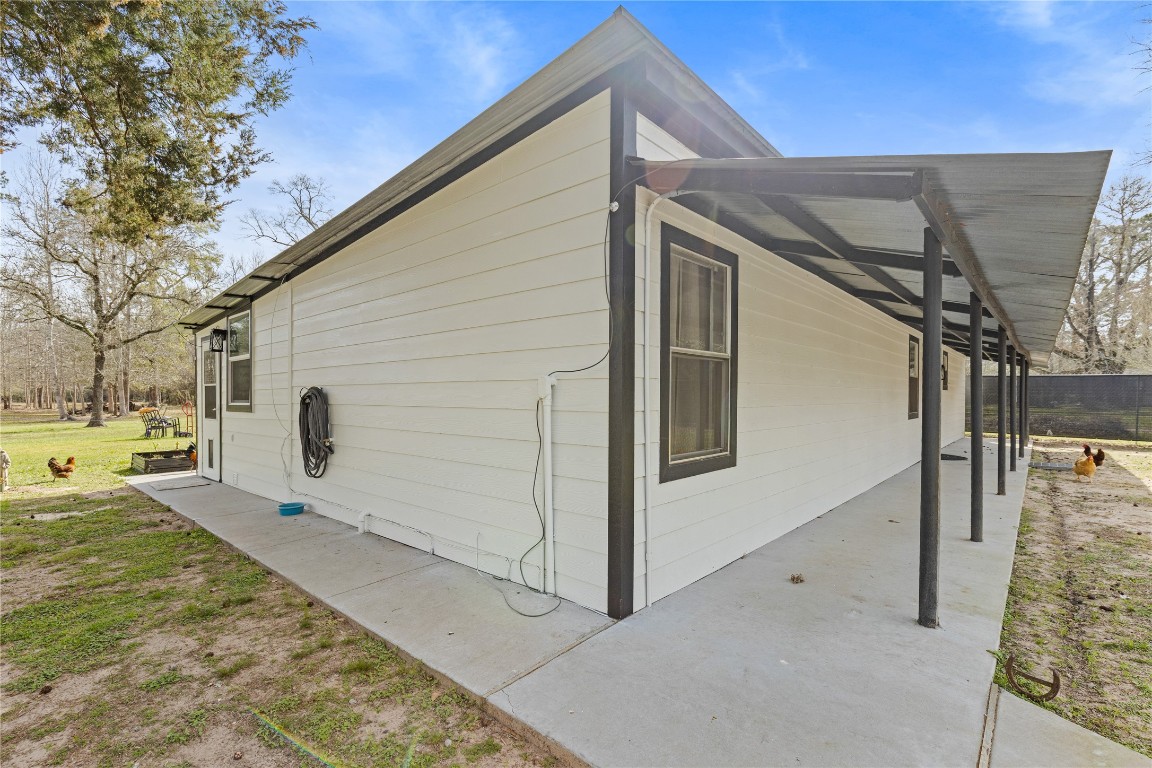 1910 Stringtown Road Shepherd, TX 77371 - Photo 19 of 24 a view of backyard with cabin