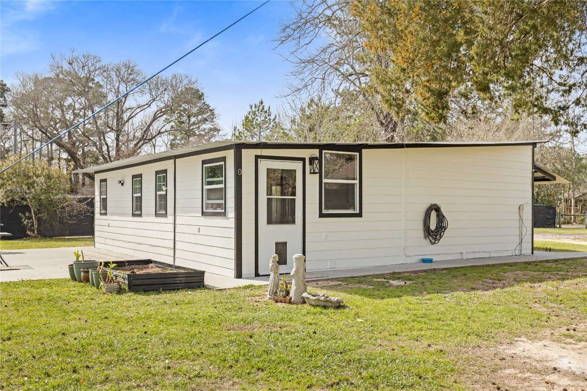 1910 Stringtown Road Shepherd, TX 77371 - Photo 20 of 24 a front view of house with yard