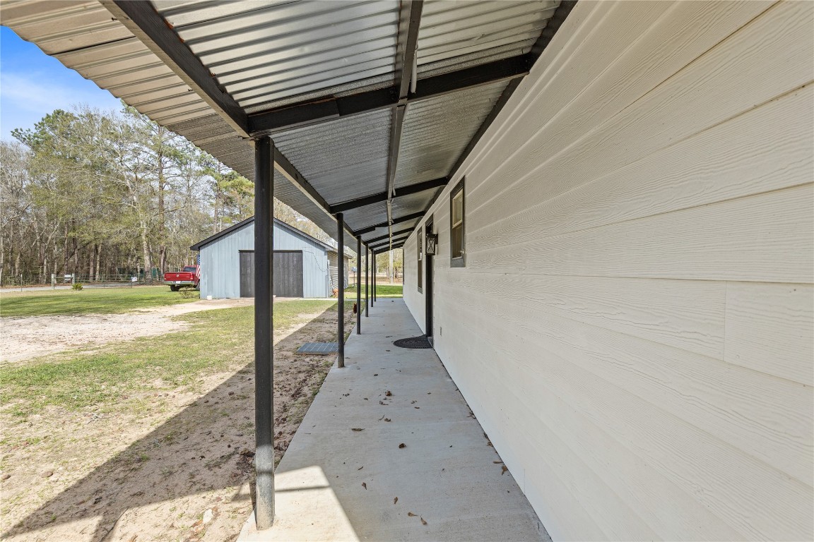 1910 Stringtown Road Shepherd, TX 77371 - Photo 3 of 24 a view of a backyard of the house