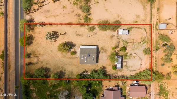 aerial view of a house with a lake view