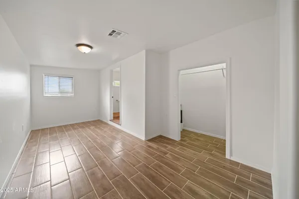 a view of an empty room and window