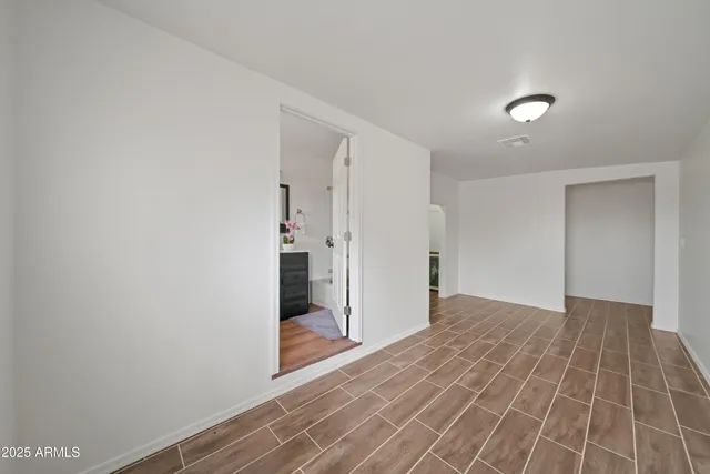 a view of a room with a hallway